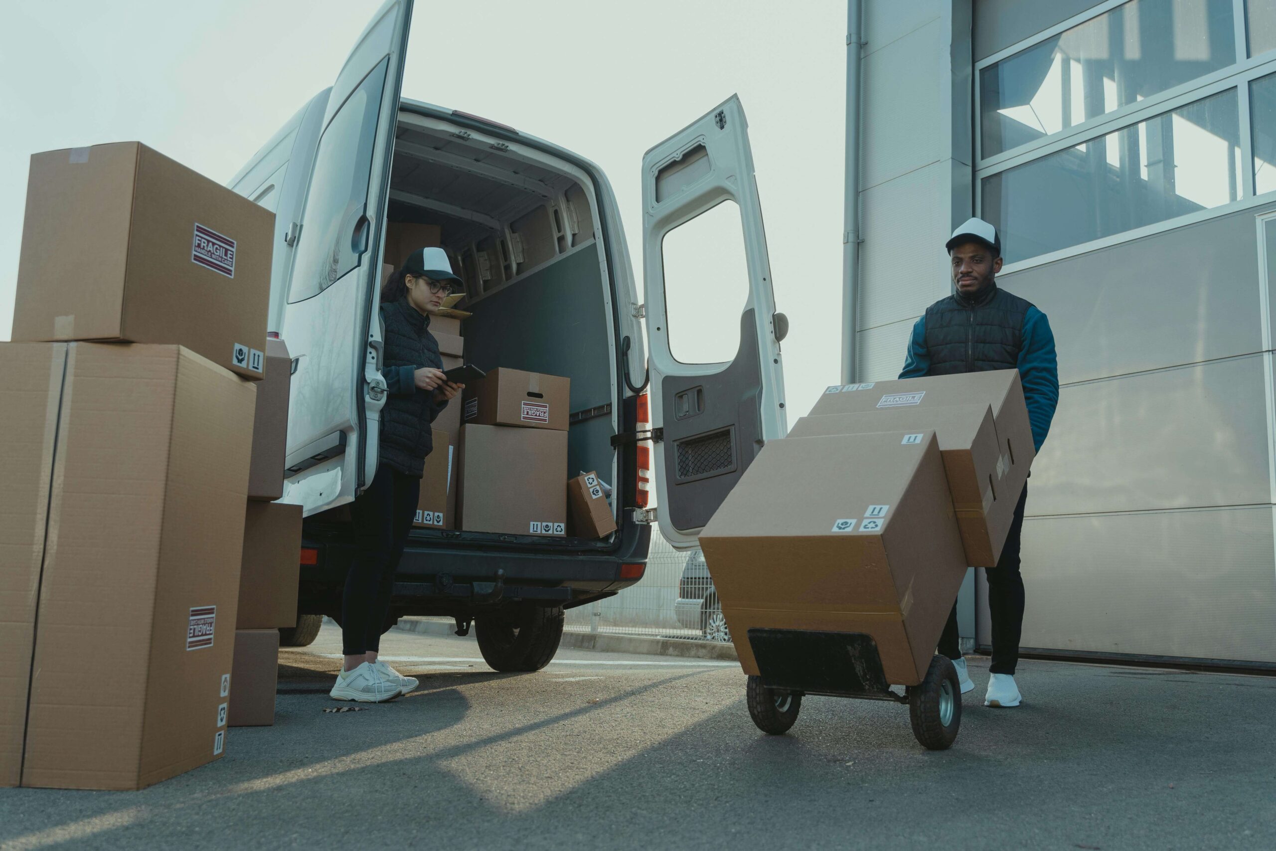 Professional movers loading boxes into a van for an interstate relocation service
